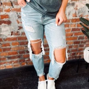 Risen Denim. High waisted, super distressed jeans. Brand new with tags. Size 11